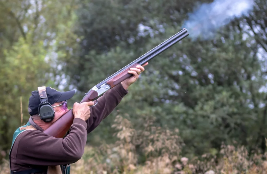 man wearing his shooting glasses while clay pigeon shooting
