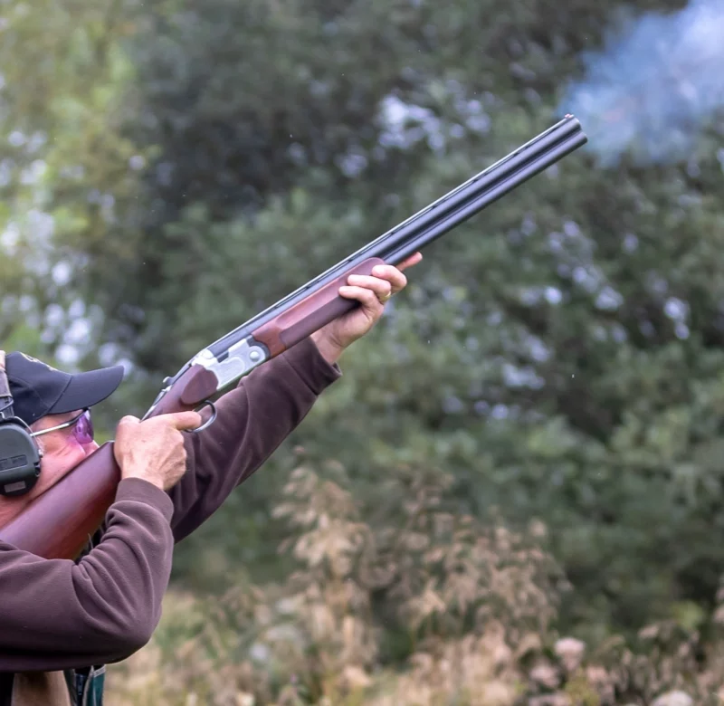 man wearing his shooting glasses while clay pigeon shooting